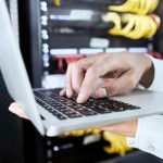 Hand, laptop or programmer working on software coding, programming or 404 error glitch for cybersecurity. Computer, internet or zoom of IT hand for research, hacking or website information technology.